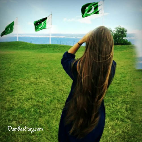A girl looking at Pakistani Flag