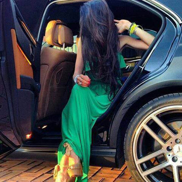 A girl with opening door of car