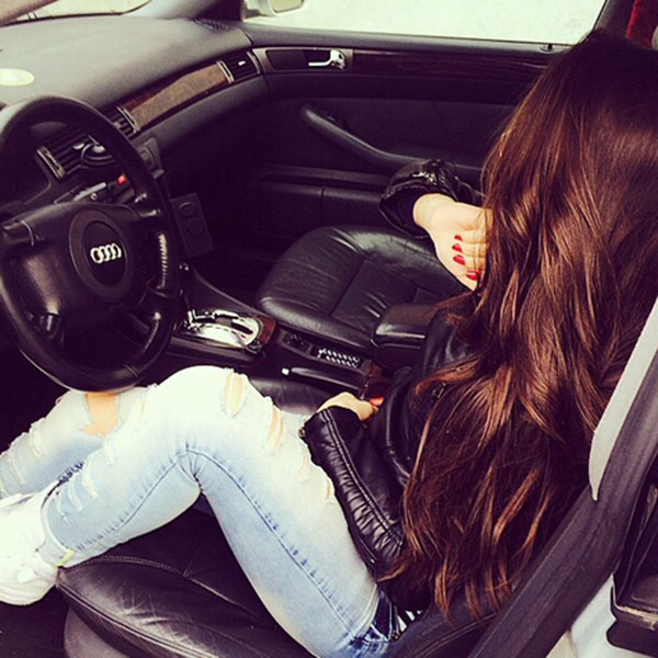 Beautiful girl relaxing in car