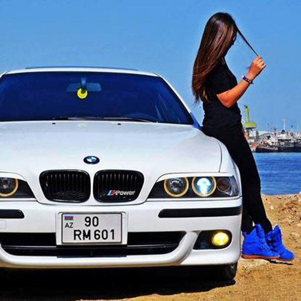 Fashion girl with car on sea site
