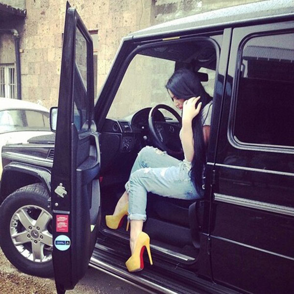 Girl with long hair coming outside of car