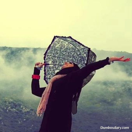 Hijabi girl in rain