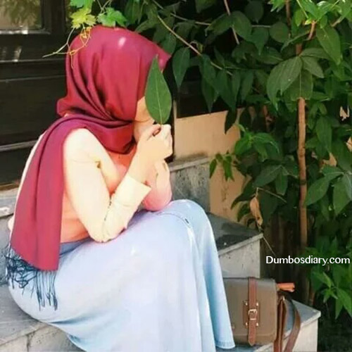 Hijabi girl sitting on stairs