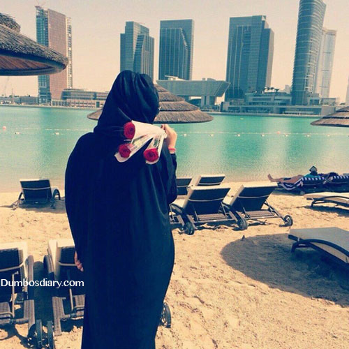 Hijabi girl watching buildings