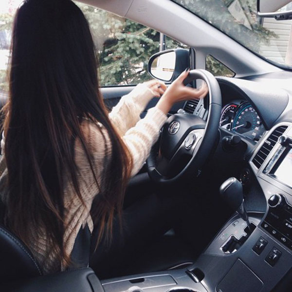 Long hair girl driving