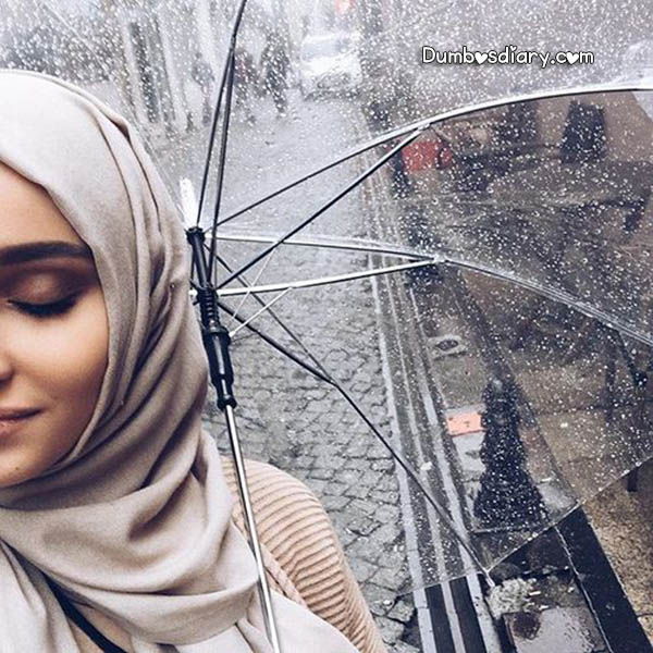 Pretty Hijabi girl with umbrella