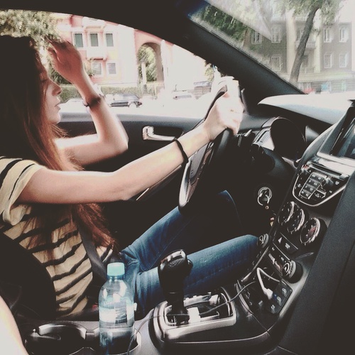 Stylish girl in smart car