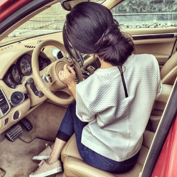 Thinking girl in car