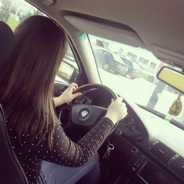 black shirt girl driving