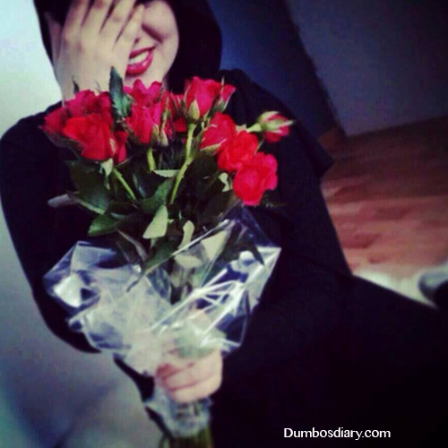 smiling muslim girl with flowers