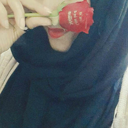 muslim-girl-hiding-her-face-with-rose