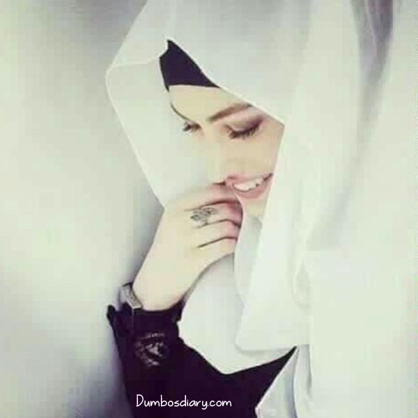 Shy hijabi girl smilimg
